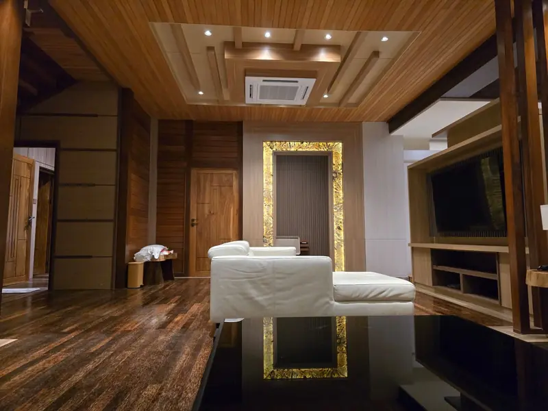 Lounge in the Grand Villa with white sofa and timber floor